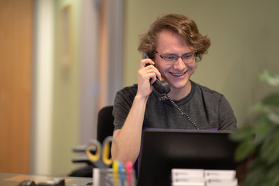 student smiling while on the phone