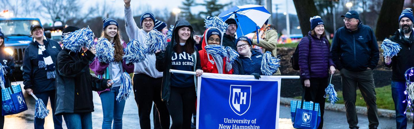 students walking in the manchester holiday parade