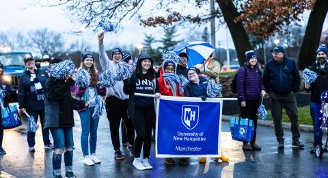 students walking in the manchester holiday parade 
