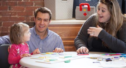 Nicholas Mian, assistant professor of psychology, and psychology student Jasmine Huffman '19, right, working on a study that measures emotions in young children.