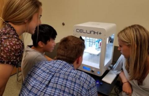 Students observe CELLINK bioprinters in action at BioHackNH, a regenerative manufacturing event held over the summer.