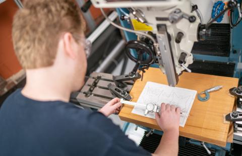 Student works on fabrication project in the engineering technology machine shop