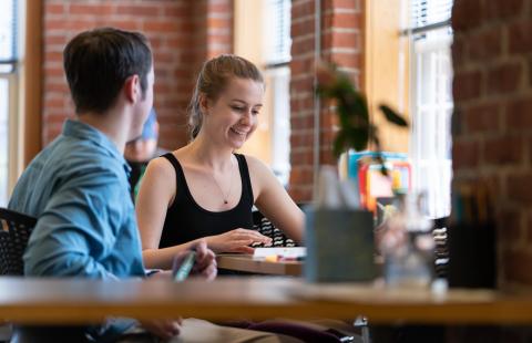 students in the library at UNH Manchester