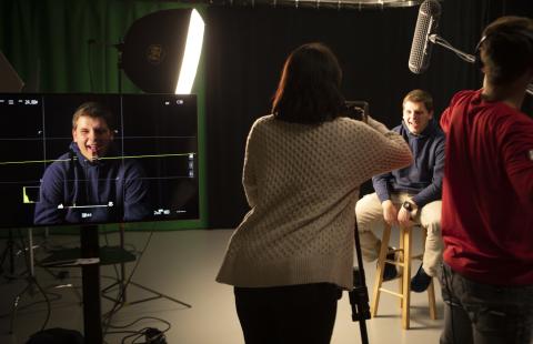 students filming in the communication arts film suite