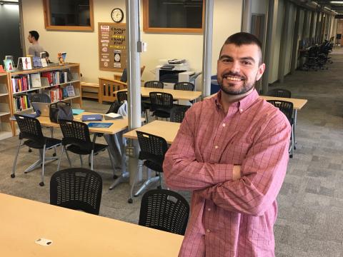 Tim Cunningham pictured in the library at UNH Manchester
