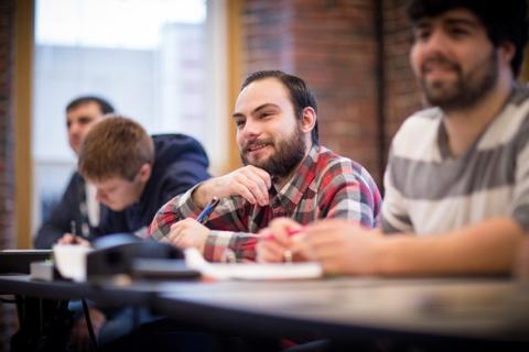 Shawn Snook '17, a graduate of mechanical engineering technology program, in class at UNH Manchester