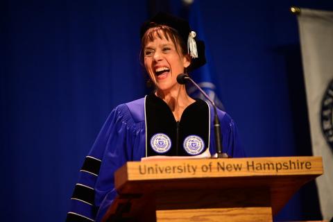 Journalist Laura Knoy delivering the keynote address at UNH Manchester's commencement ceremony on Friday