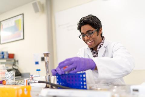 Millyard scholar and biotechnology major Fardeen Siddiqui '23 in the lab at UNH Manchester