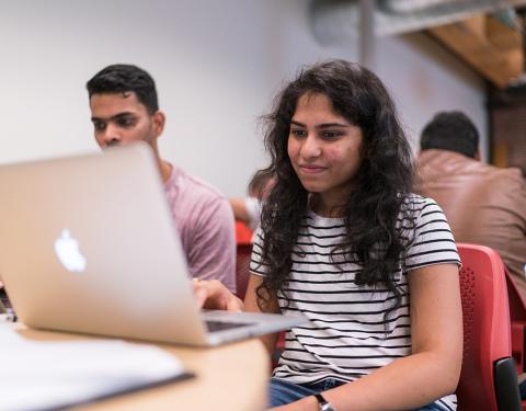 student sitting in cyberengineering class