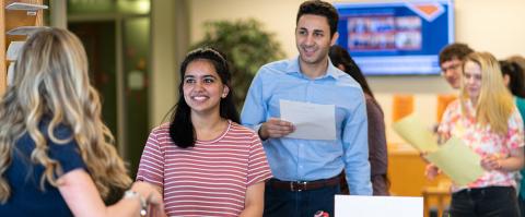 students standing in line to register for classes