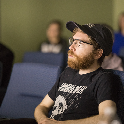 Bearded student engaged in a lecture