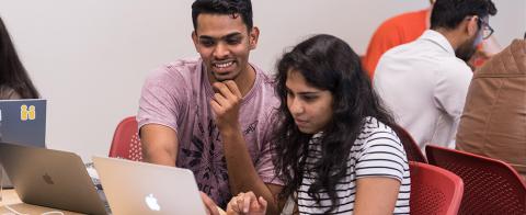 student sitting at a computer