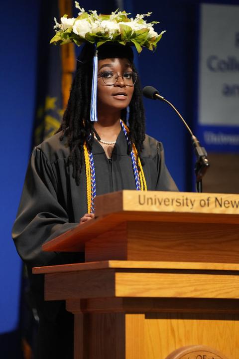 Jordan White '24 delivering UNH Manchester student address at commencement