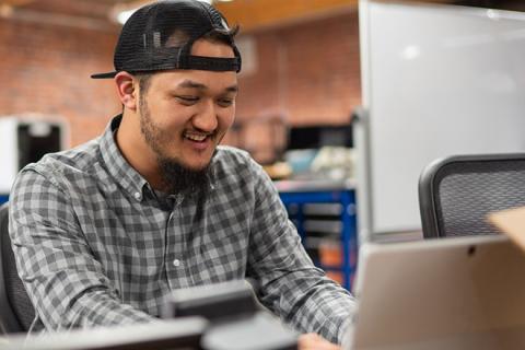 male student with a computer