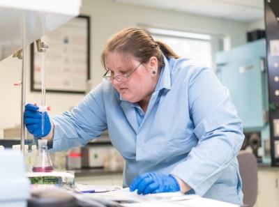 Biotechnology graduate Becky Baker '16 runs tests on water samples during her internship at Manchester Water Works in 2016.